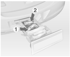 Enlever d'abord le feu arrière du logement avant (1), puis celui du logement