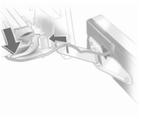 Abaisser le levier de blocage et pousser le support d'ampoules dans le dispositif