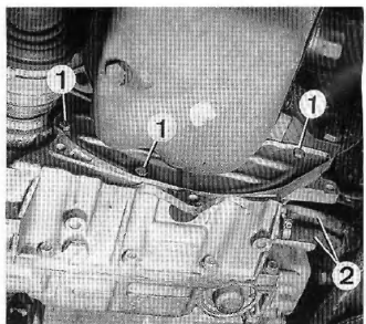 Fleches : vis de carter de protection du convertisseur